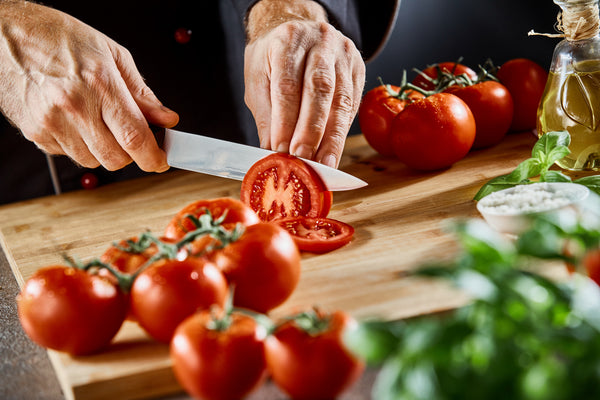 A Step-By-Step Guide to Slicing a Vine-Ripened Tomato