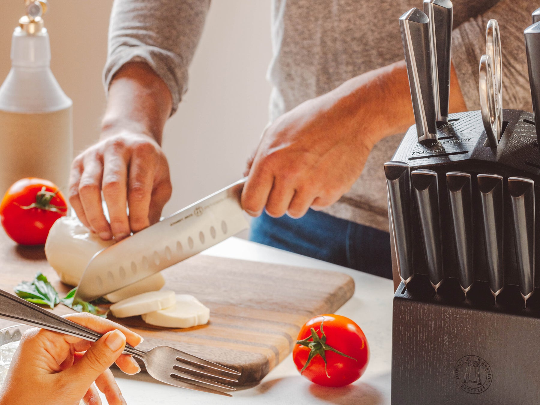 This 14-piece knife set with a built-in sharpener cuts everything