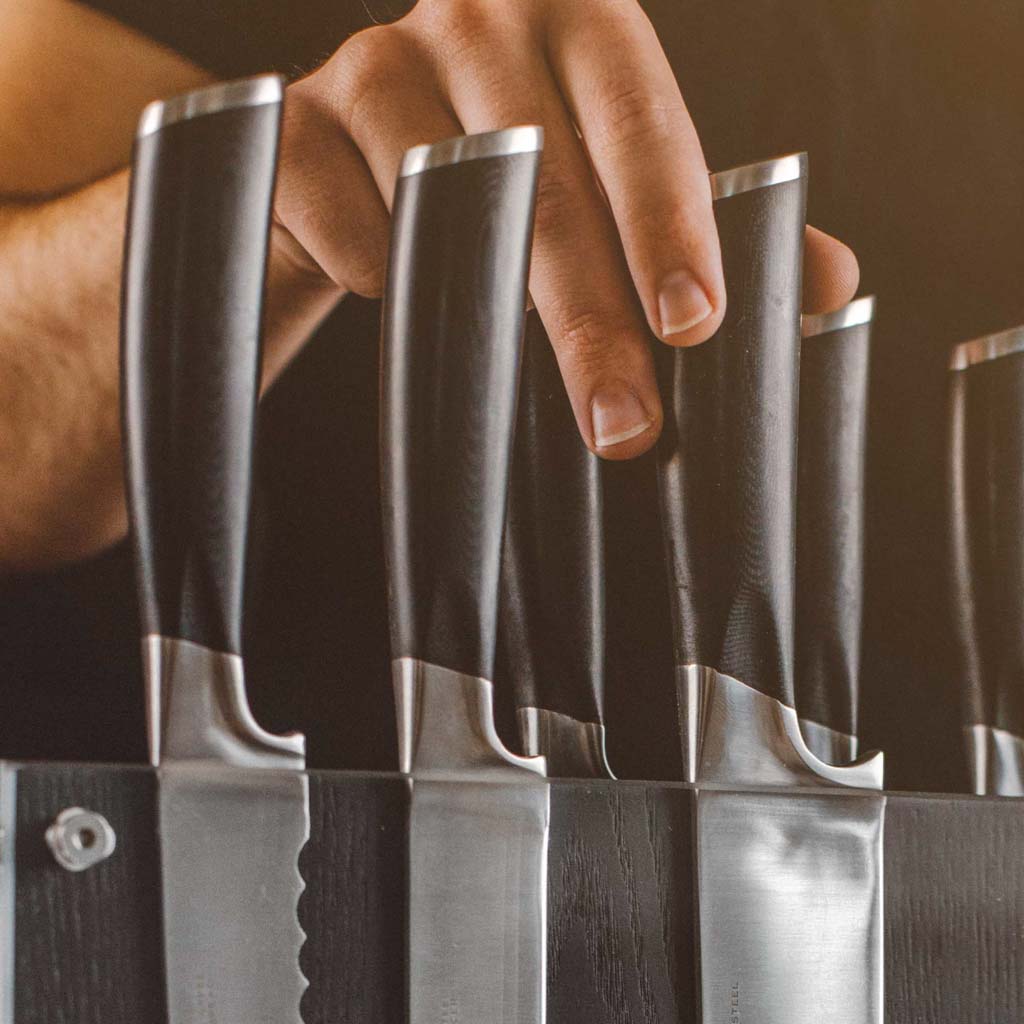 https://schmidtbrothers.com/cdn/shop/products/schmidt-brothers-kitchen-cutlery-schmidt-brothers-bonded-ash-7-piece-knife-set-high-carbon-stainless-steel-cutlery-with-black-ash-wood-and-acrylic-magnetic-knife-block-28383272206397_1400x.jpg?v=1633361167