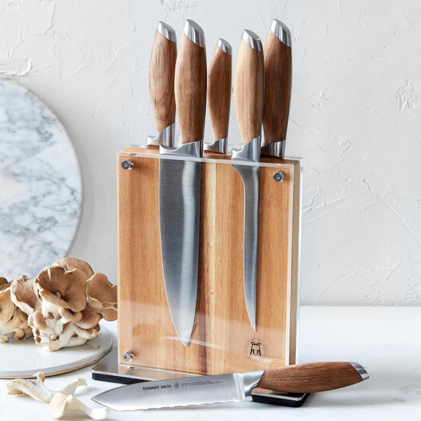https://schmidtbrothers.com/cdn/shop/products/schmidt-brothers-kitchen-cutlery-schmidt-brothers-bonded-teak-7-piece-knife-set-high-carbon-stainless-steel-cutlery-with-acacia-and-acrylic-magnetic-knife-block-28288503480381_1400x.jpg?v=1683912740